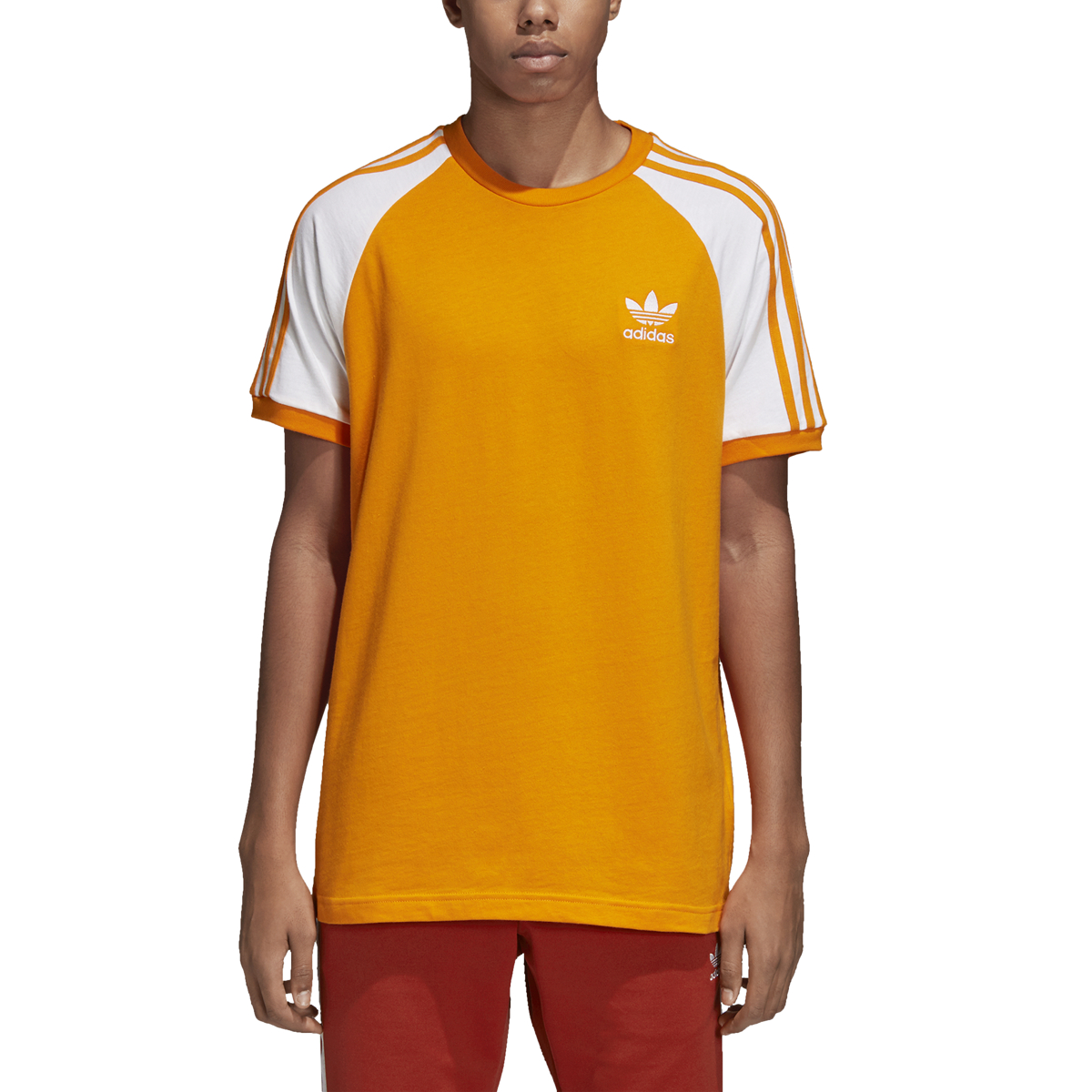 white adidas with orange stripes